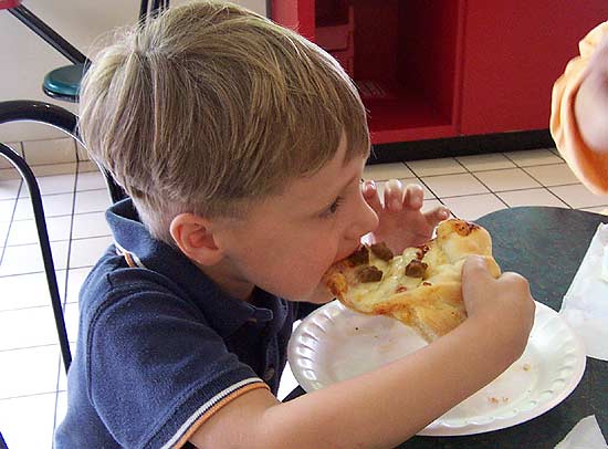 Bond devouring some fantastic pizza At Holiday World, Santa Claus Indiana